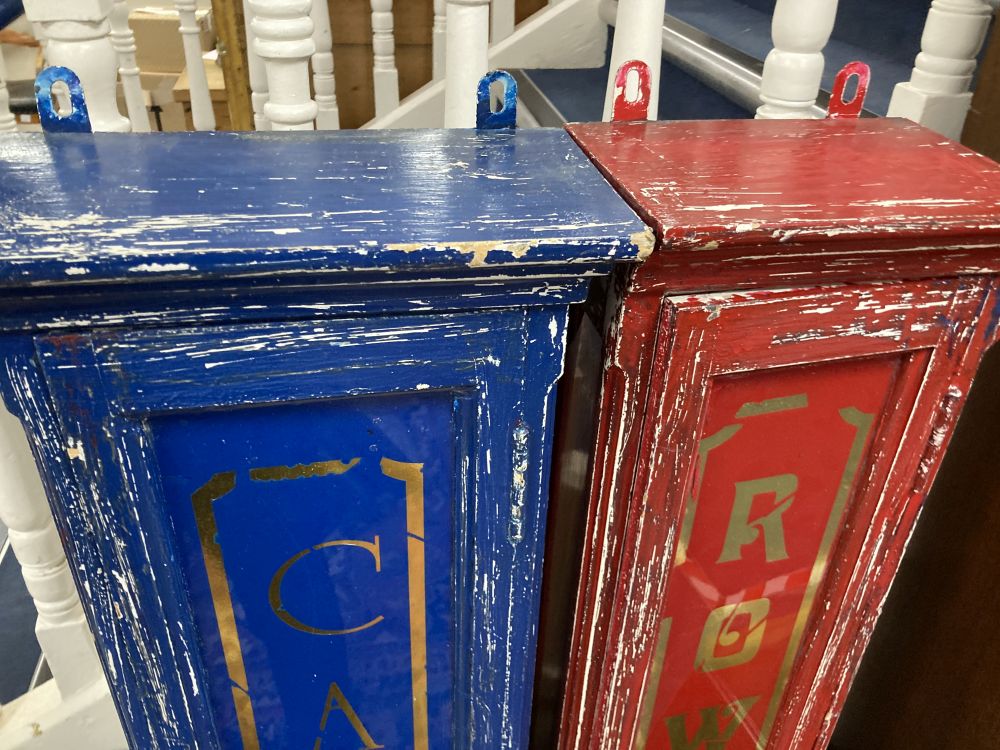 Two painted wood shop display cabinets, the glass doors marked Cadburys and Rowntrees, largest width 34cm height 140cm